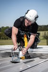 man_working_on_roof_525x788px